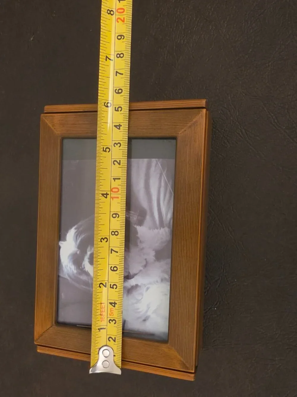 Vintage wooden jewelry box with a picture frame features a rectangular shape